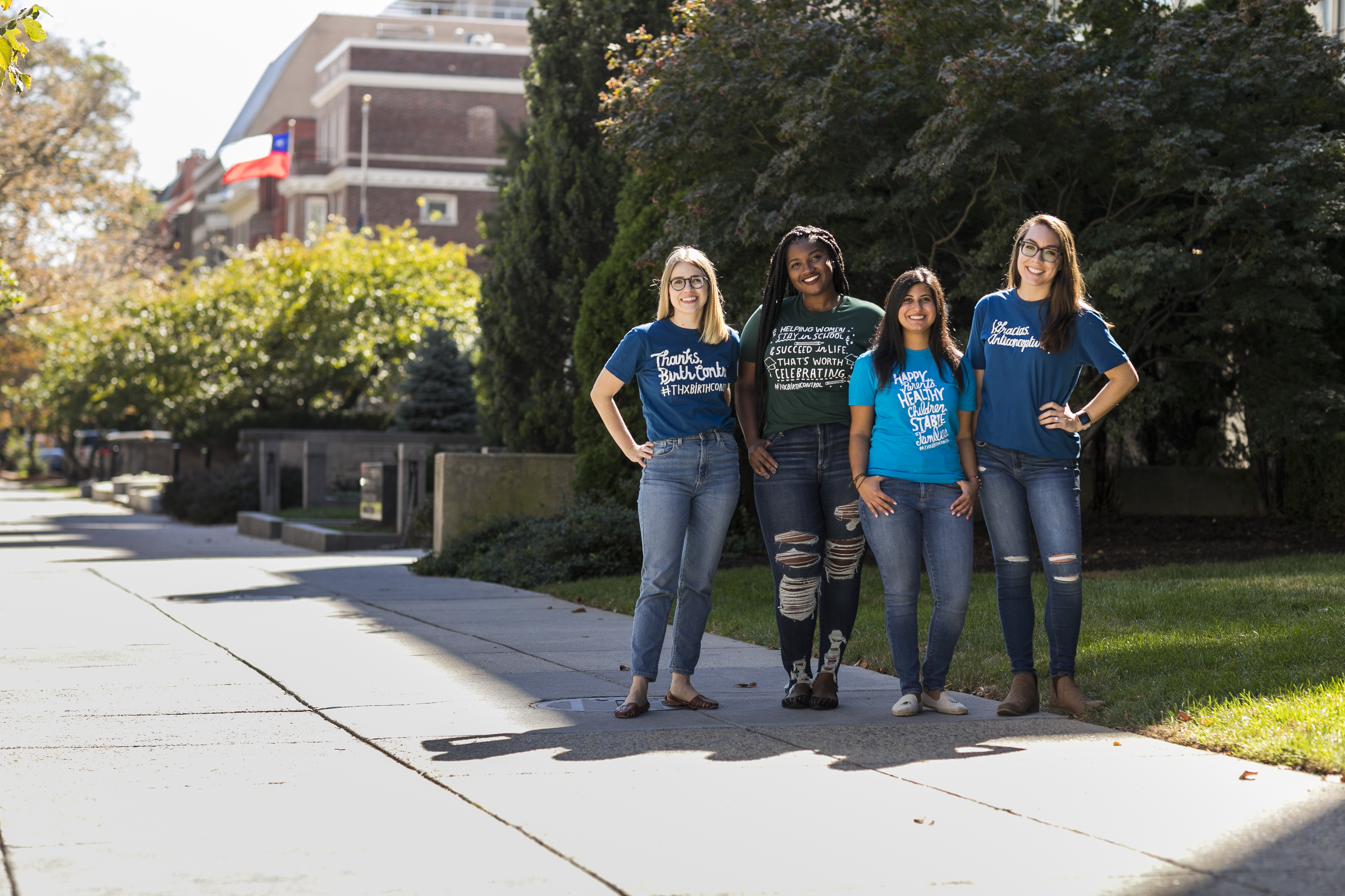 Four people wearing Thanks, Birth Control tshirts