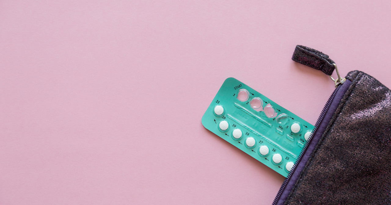 A pack of birth control pills spilling out of a purse