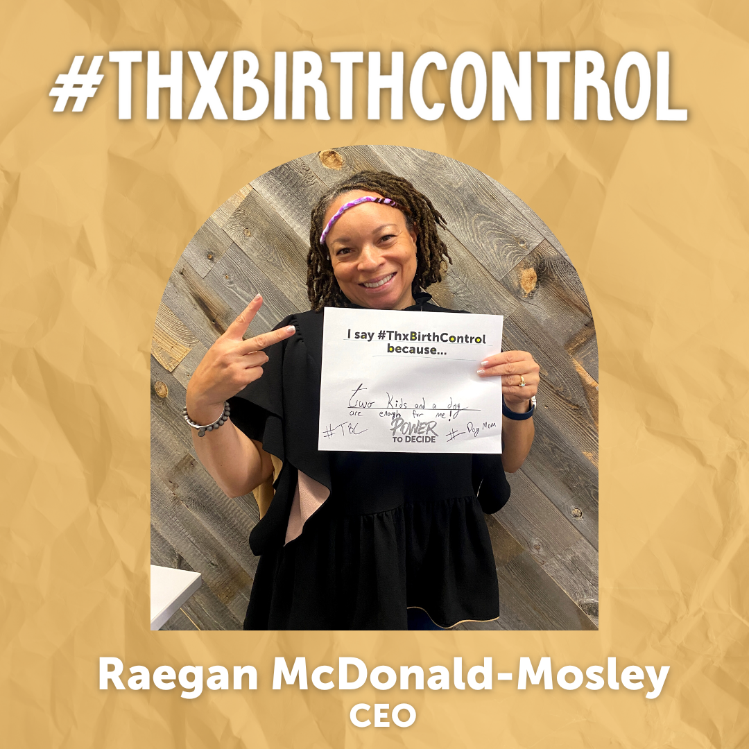 A Power to Decide Staffer holds a sign with their reason for saying #ThxBirthControl.