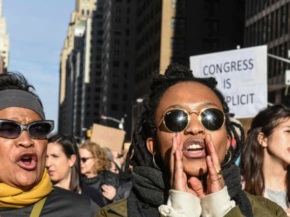 Black women yell at a protest
