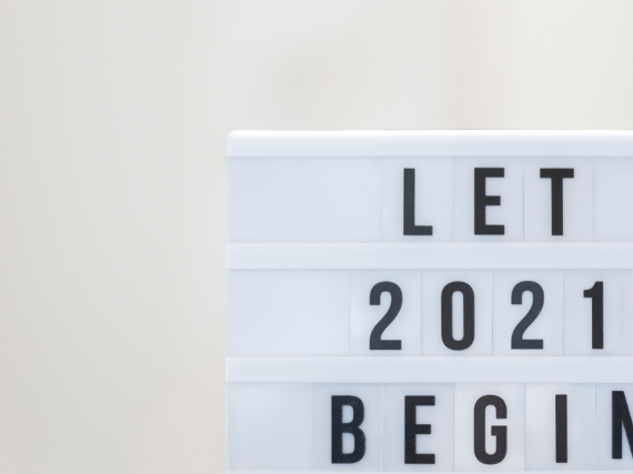 A lightboard with the words, "Let 2021 Begin"